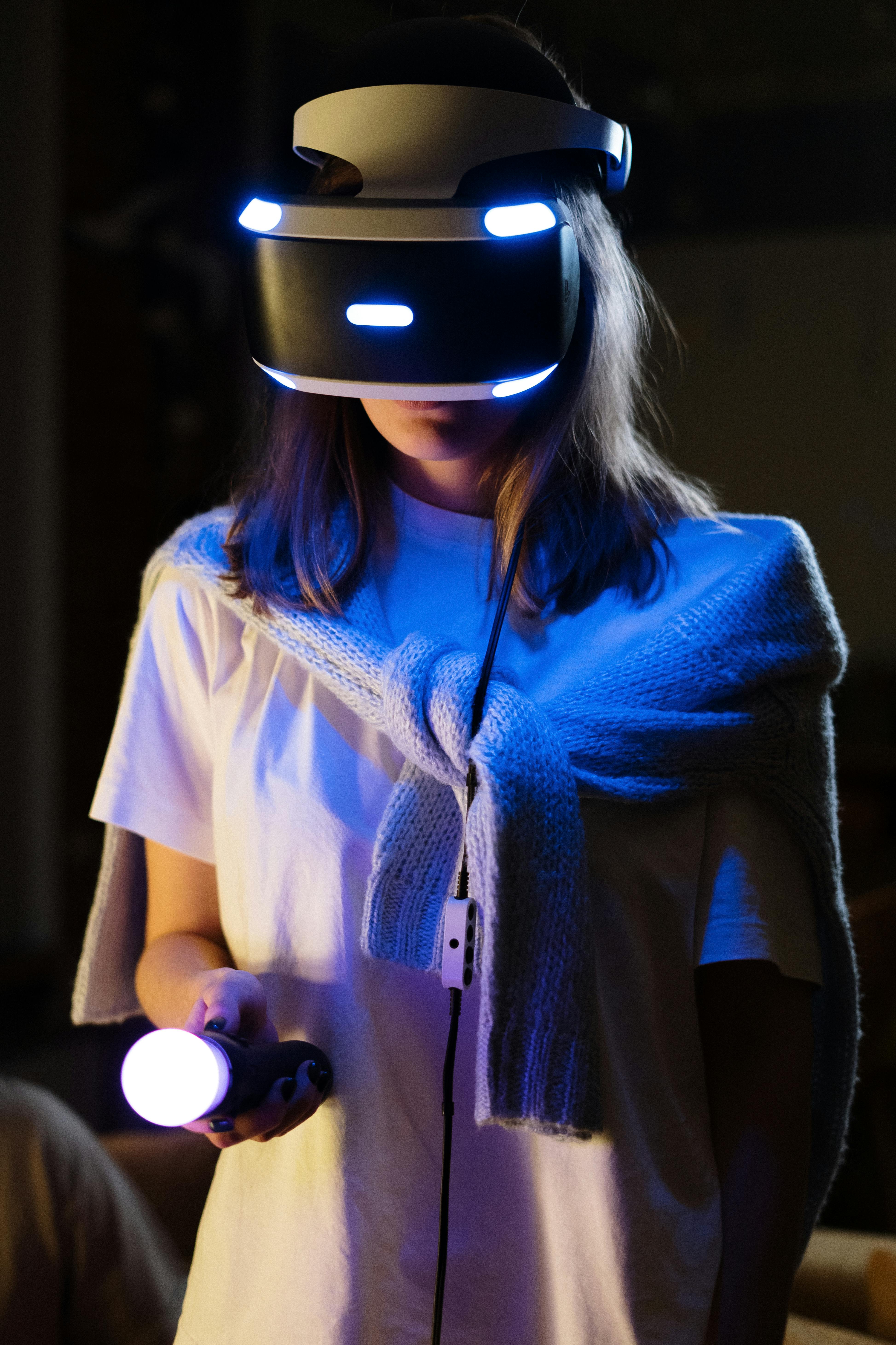 A young woman immersed in virtual reality gaming, wearing a VR headset and controller.